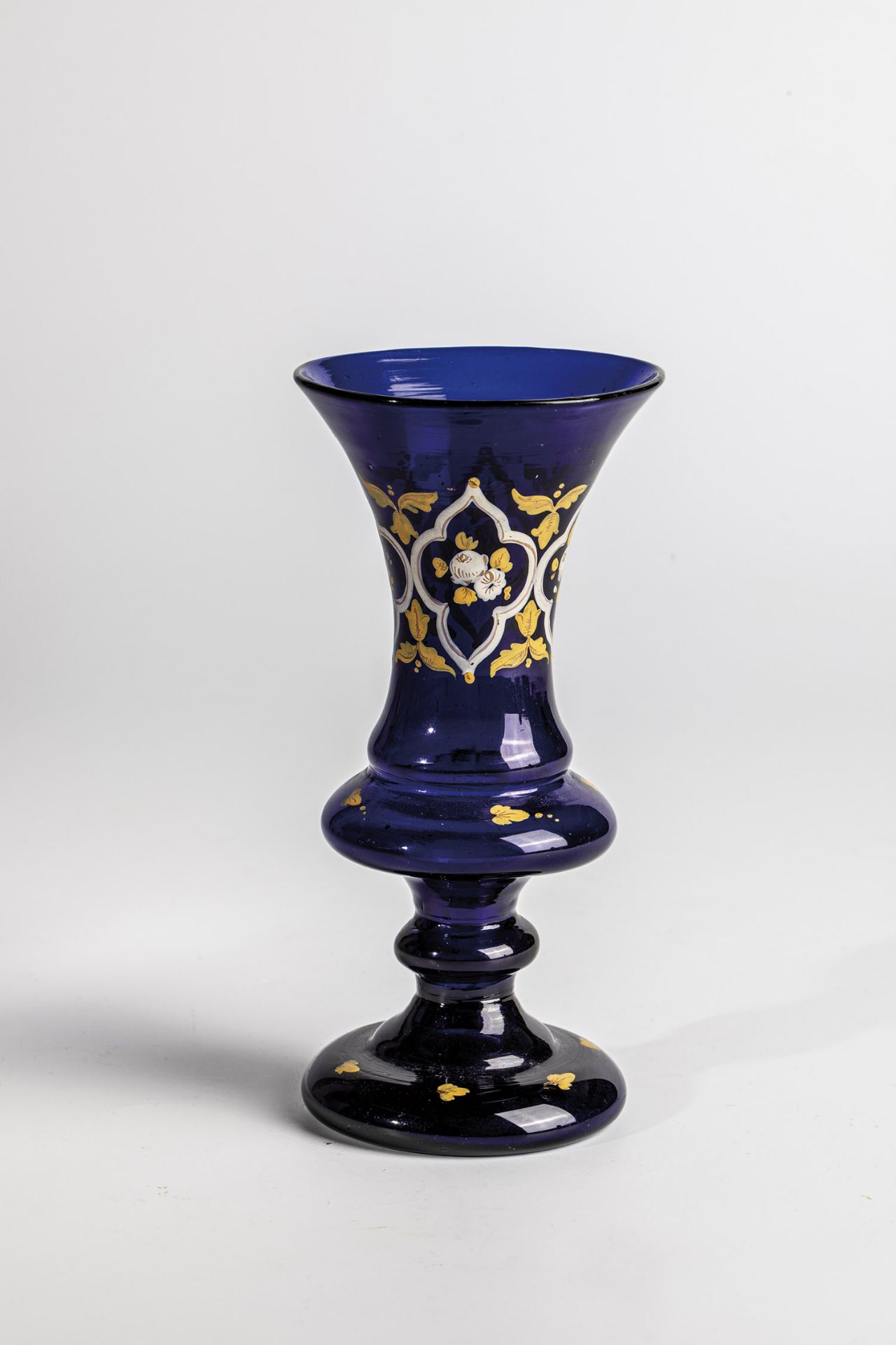 Small vase, 19th century, cobalt blue glass with demolition. Floral decor in white, yellow enamel