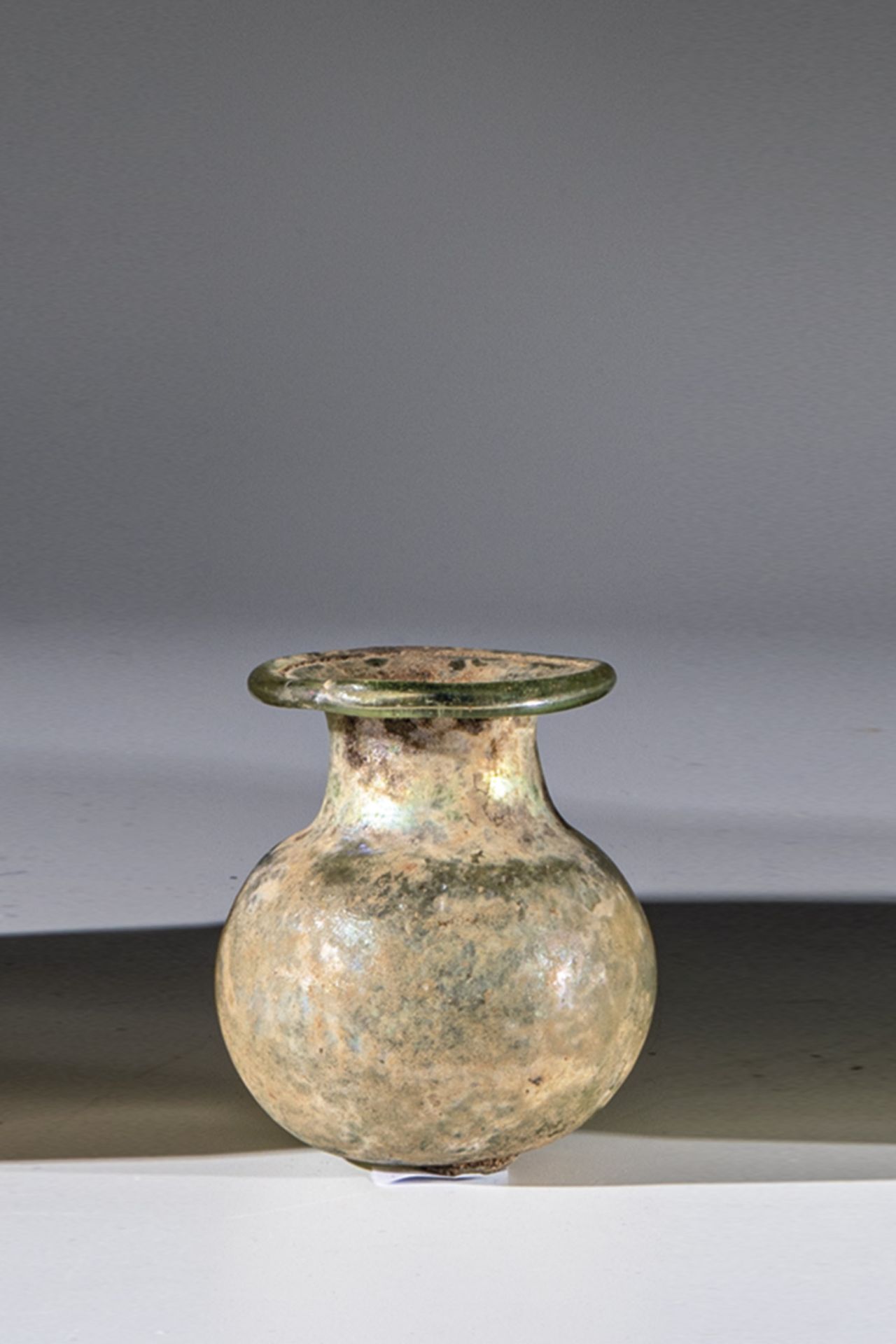 Small spherical bottle Middle East, 4th-5th century AD Bottom find. Light green glass. Short tubular