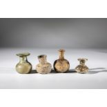 Four miniature vials Middle East, 1st-4th century AD Bottom finds. Greenish glass, partly with a