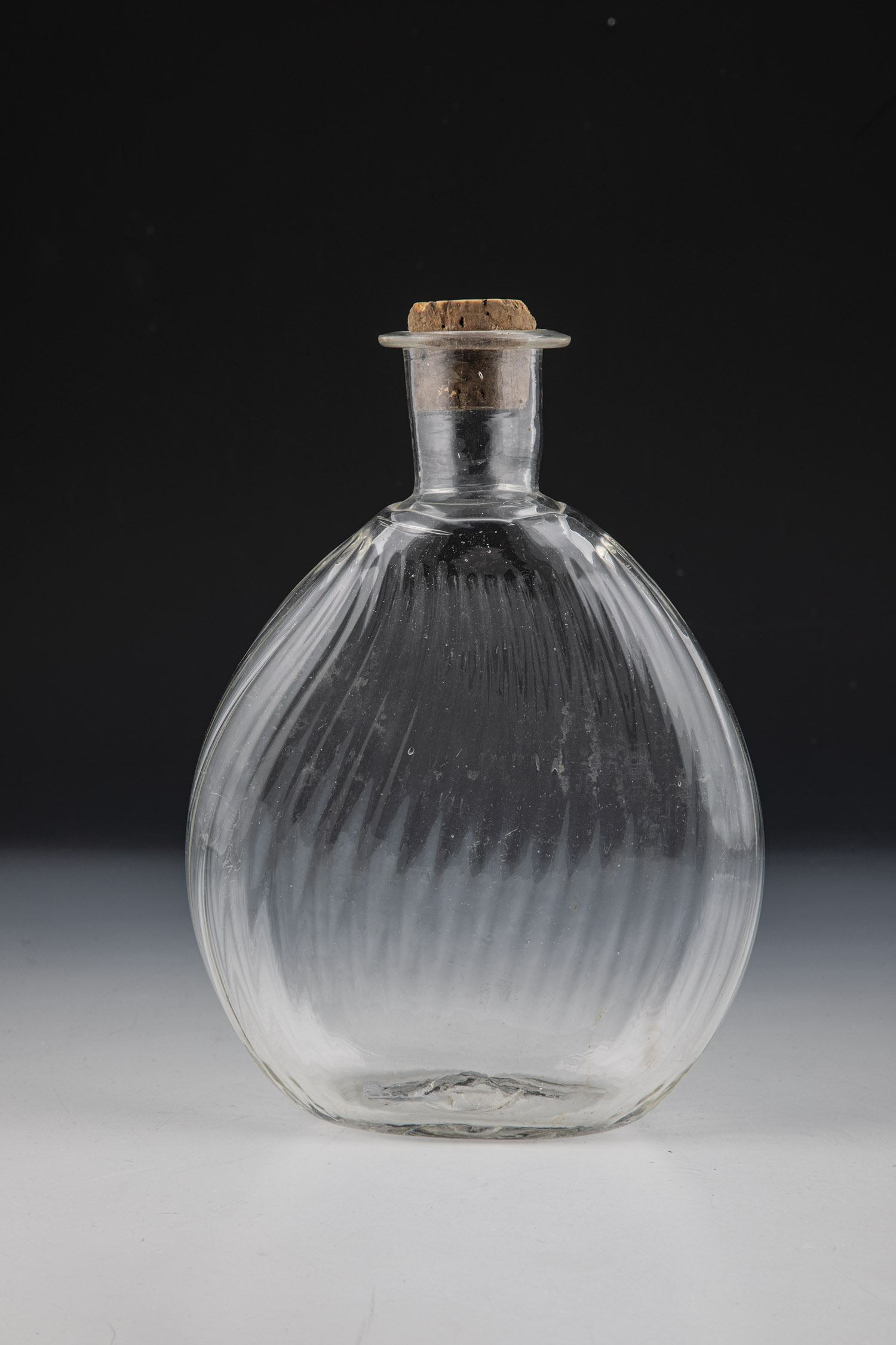 Bag bottle German, 18th century Colourless, longitudinally optically blown glass with tear-off.