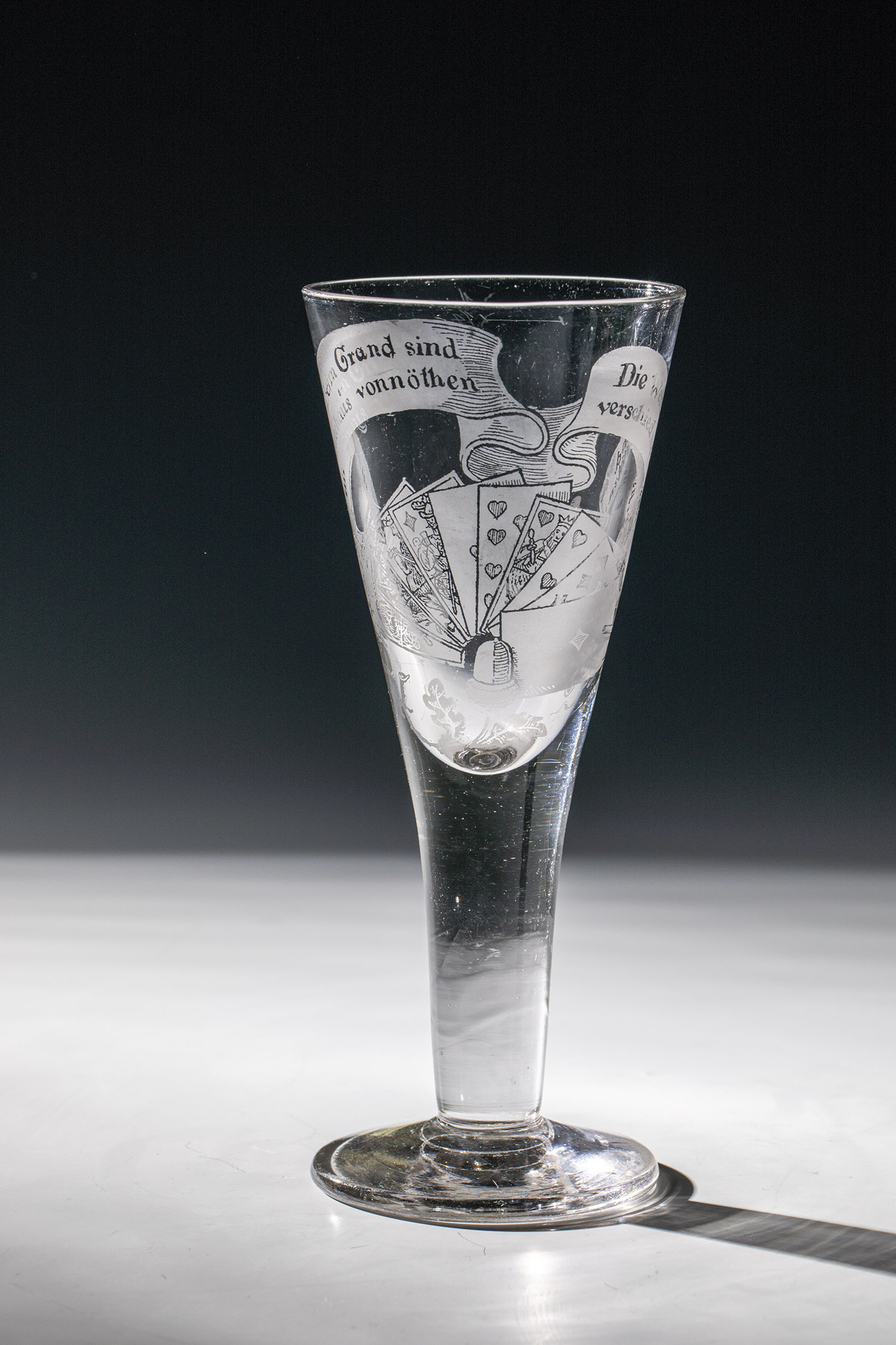 Goblet with Skat motto and playing cards North German, E. 19th century Colourless glass. Disc