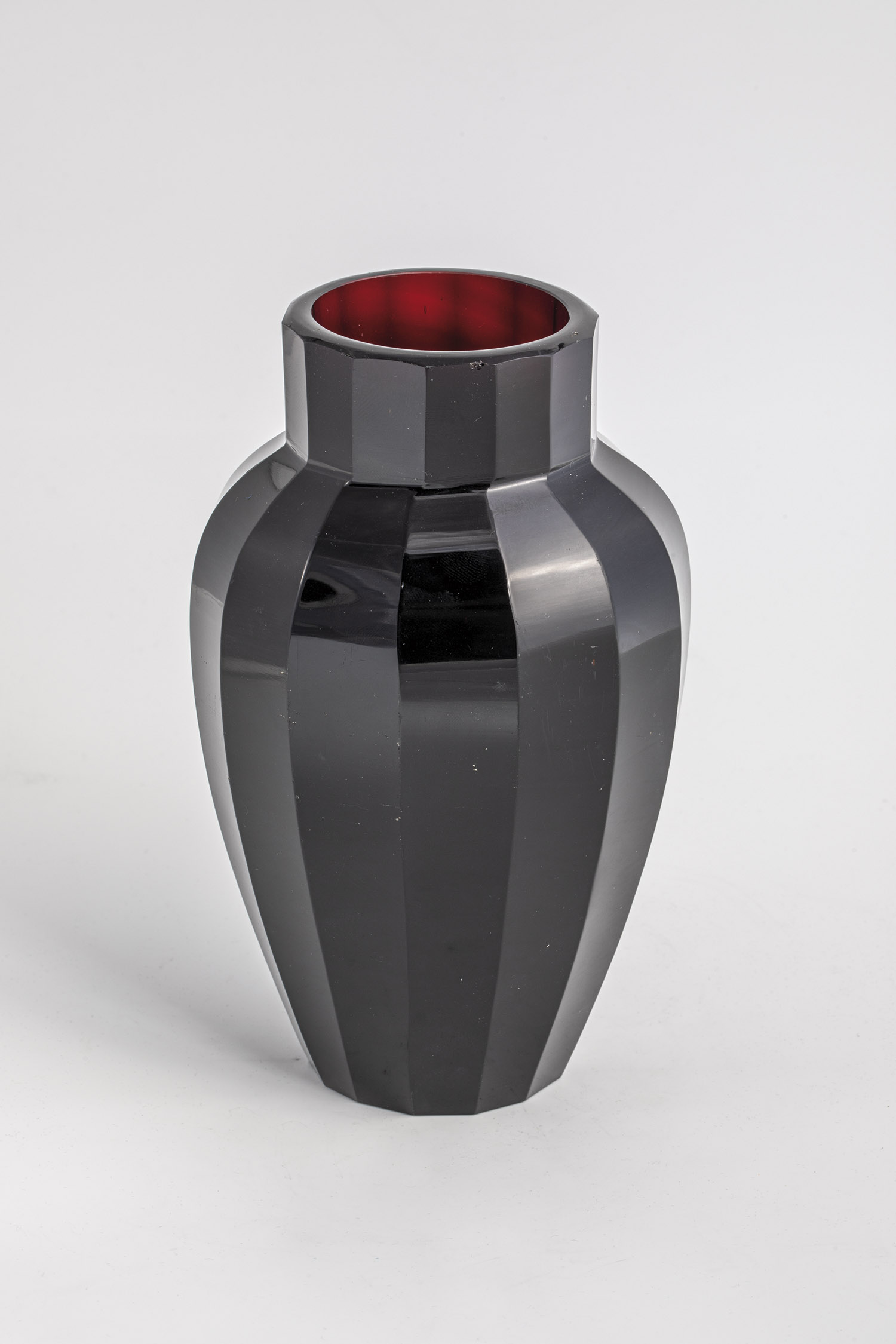 Moser vase, Karlovy Vary, 1920s Ruby red glass with fourteen-sided peel cut. H. 17 cm.