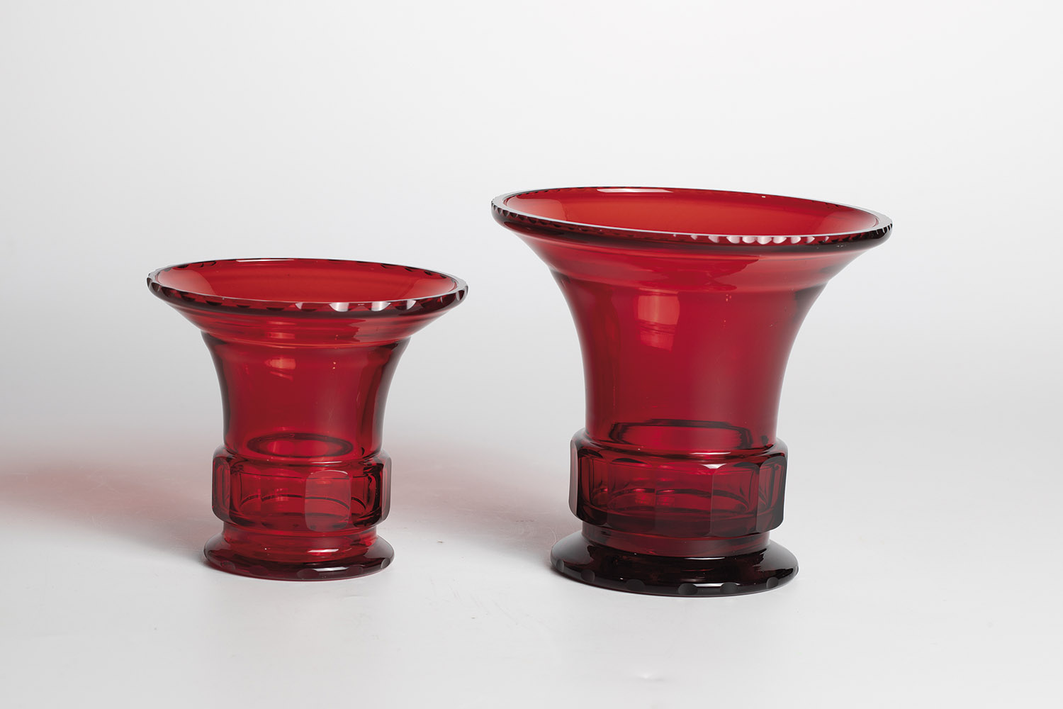 Two vases Jean Beck, Munich, ca. 1920 Red glass with cut decoration. Both vases on the bottom