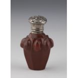 Miniature bottle of Buquoy's huts, mid-19th century Sealing wax red stone glass with silver mount.