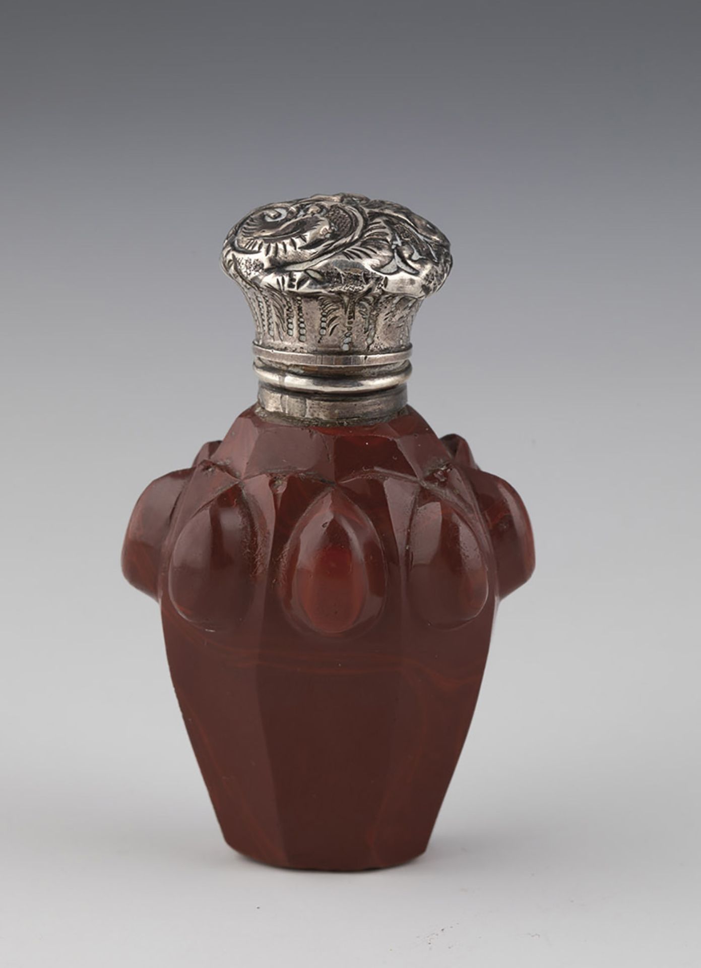 Miniature bottle of Buquoy's huts, mid-19th century Sealing wax red stone glass with silver mount.