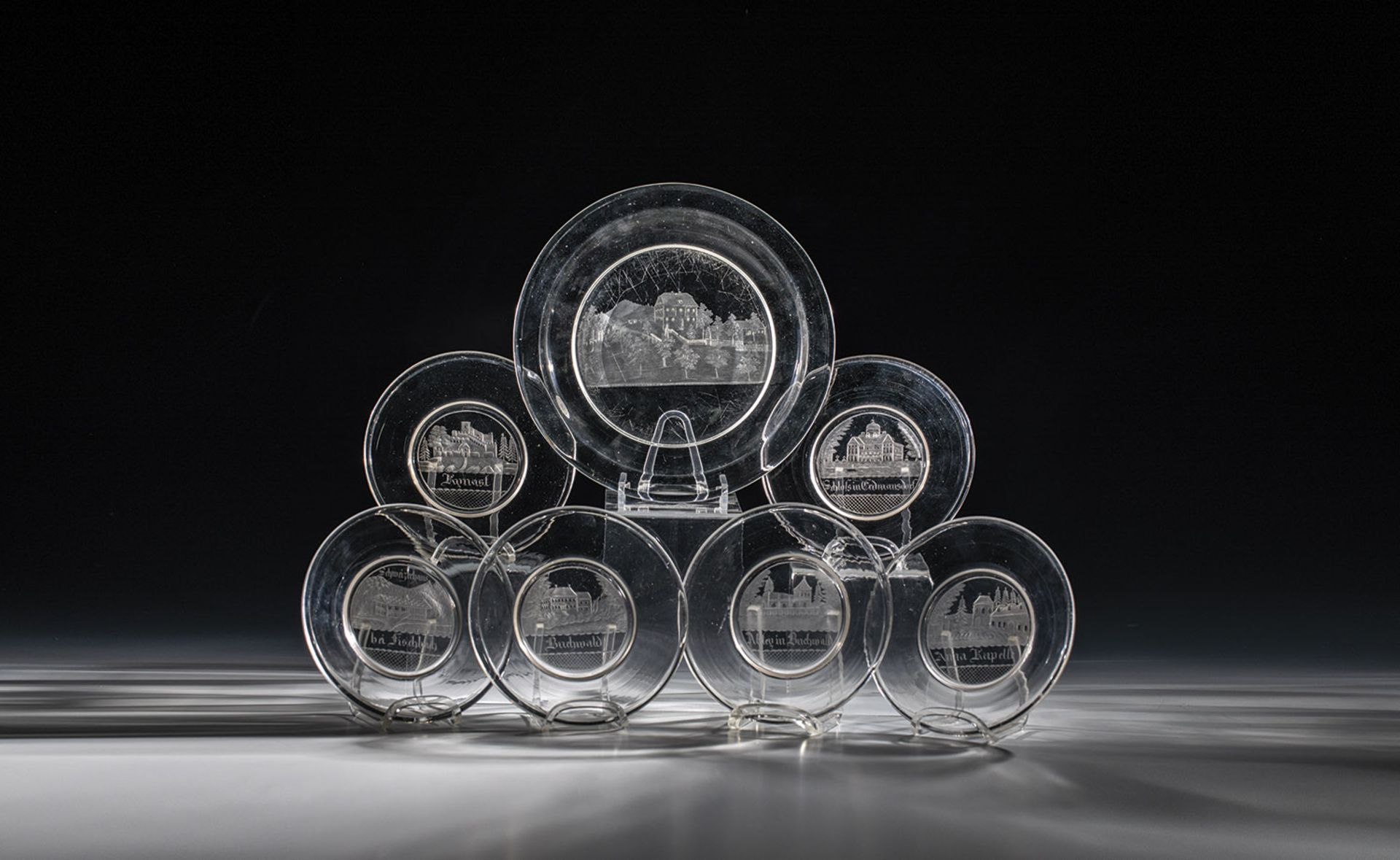 Plate set KrkonoÅ¡e 19th century Consisting of six small and one large plate. Colourless glass