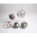 Five paperweights at the end of the 20th century: Five paperweights made of glass, one signed ''
