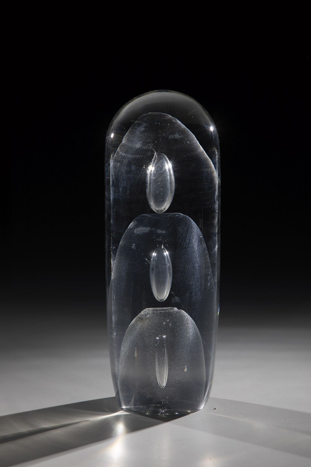 Object Theodor G. Sellner, 1982 Colourless glass, three air bubbles pierced in the centre. Thick-