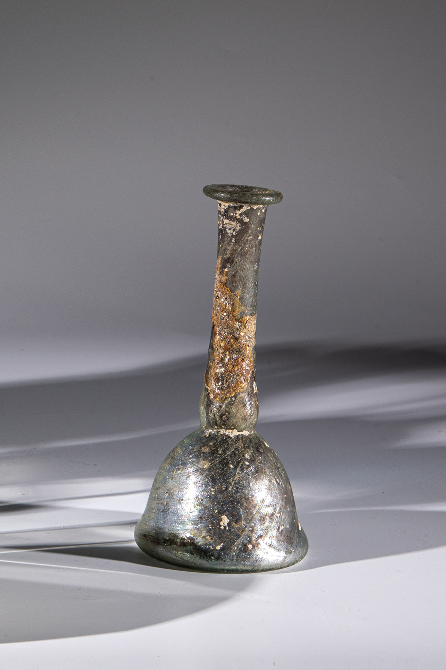 Bottle Middle East, 3rd-4th century A.D. Light green glass. Bell-shaped wall. Muzzle with upturned