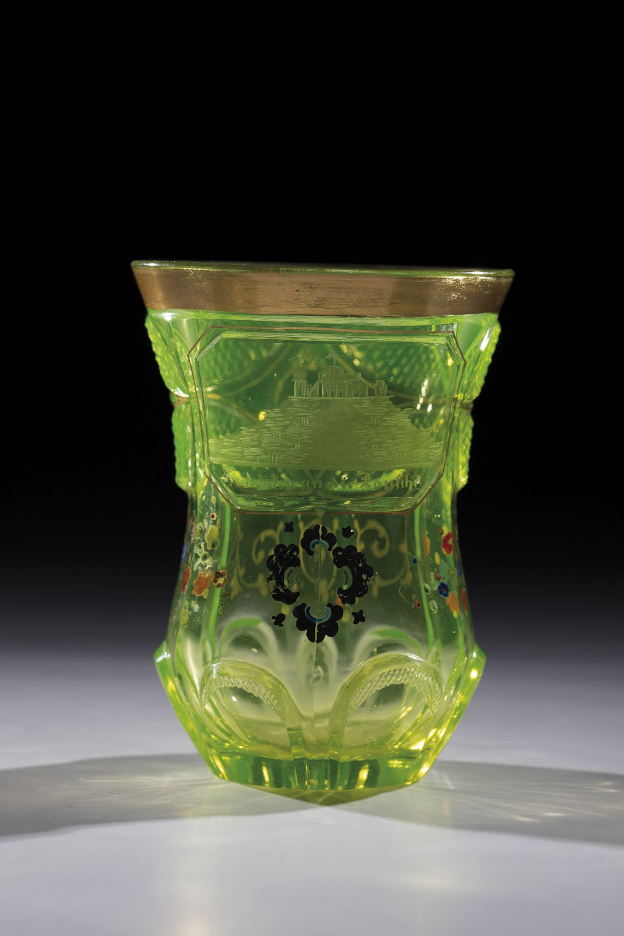 Uranium glass beaker with a view of Bohemia, ca. 1840 Uranium glass. Back with notched star. Base of