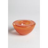 Small bowl Kosta Boda, thick-walled, colorless glass with orange interlayer decoration. Underside