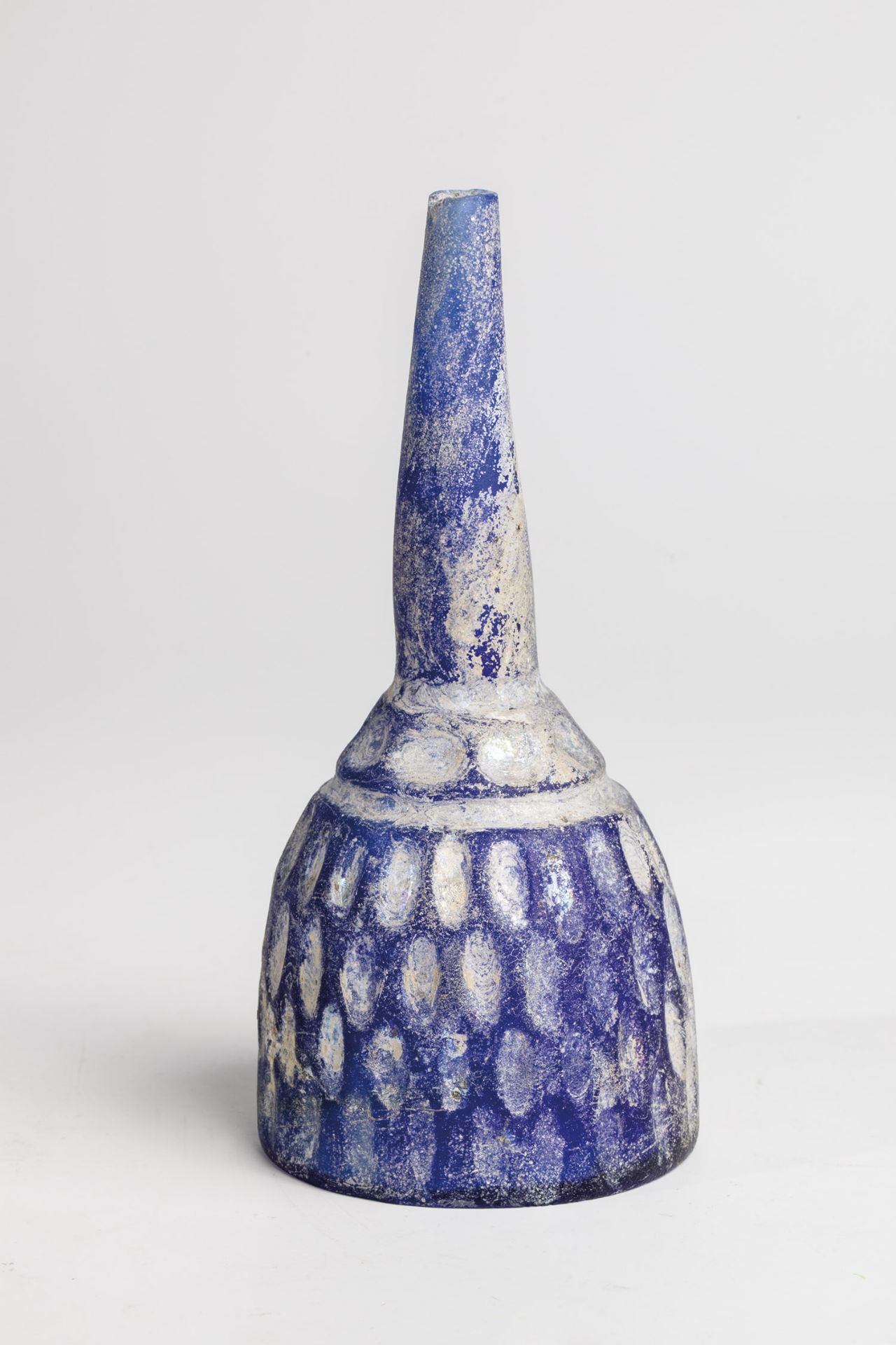 Bottle probably Iran, 9th-10th century A.D. Found in the ground. Cobalt blue glass with cut