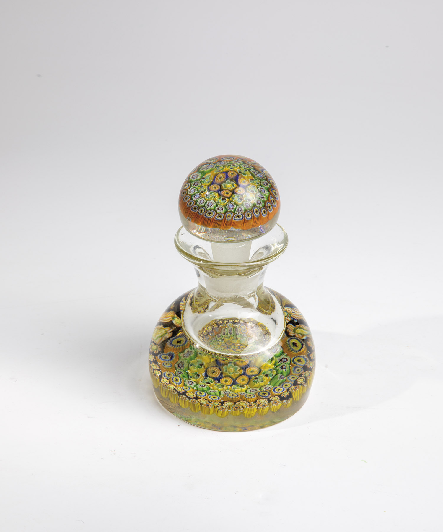 BOTTLE WITH STOPPER Murano, after 1900 Colourless glass. Base and plugs with various millefiori rods