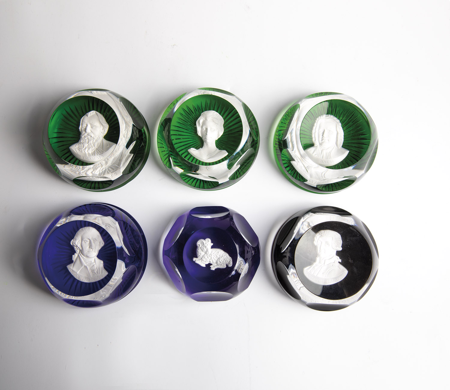 Six paperweights Baccarat, second half of the 20th century On a green and blue background, busts