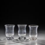 Three drinking glasses Germany, 19th century Colourless glass with tear-off. One lip margin min.