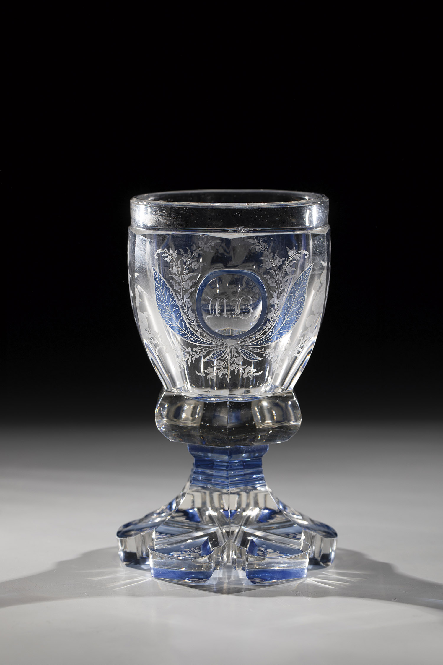 Colourless, partly blue glazed glass. Six-pass foot. Underside with engraved floral decoration. - Image 2 of 2