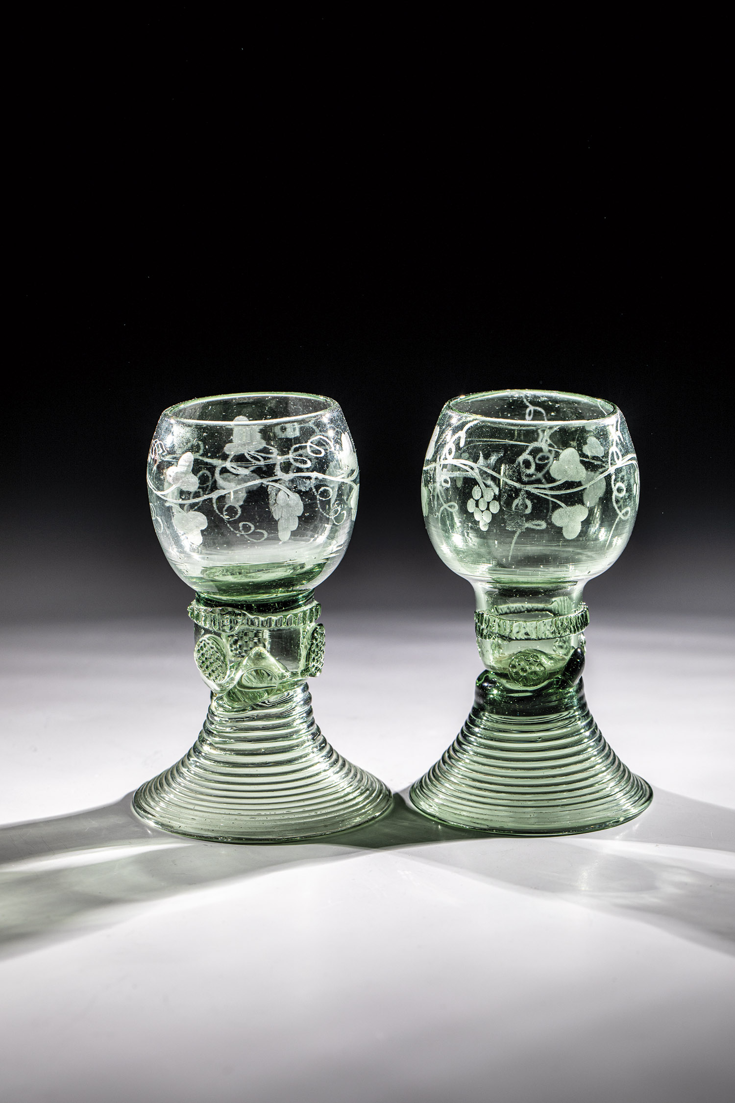 Two Romans with wine decor Germany, 18th century Light green glass with demolition. Raised, spun