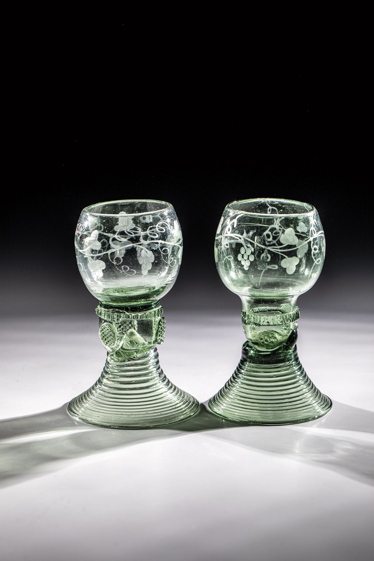 Two Romans with wine decor Germany, 18th century Light green glass with demolition. Raised, spun