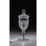 Lidded goblet with the four elements of Silesia, 2 H. 18th century. Manganese-tinged glass. The disc