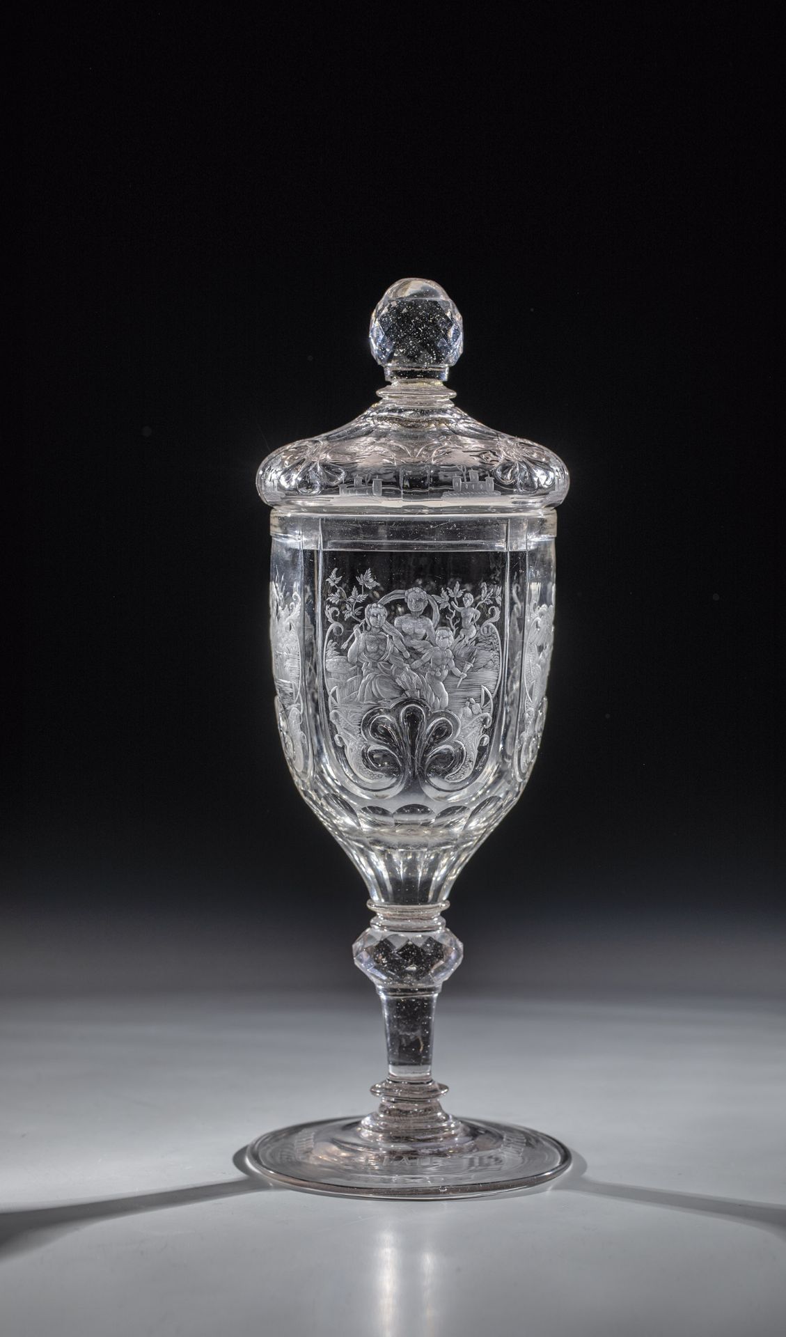 Lidded goblet with the four elements of Silesia, 2 H. 18th century. Manganese-tinged glass. The disc