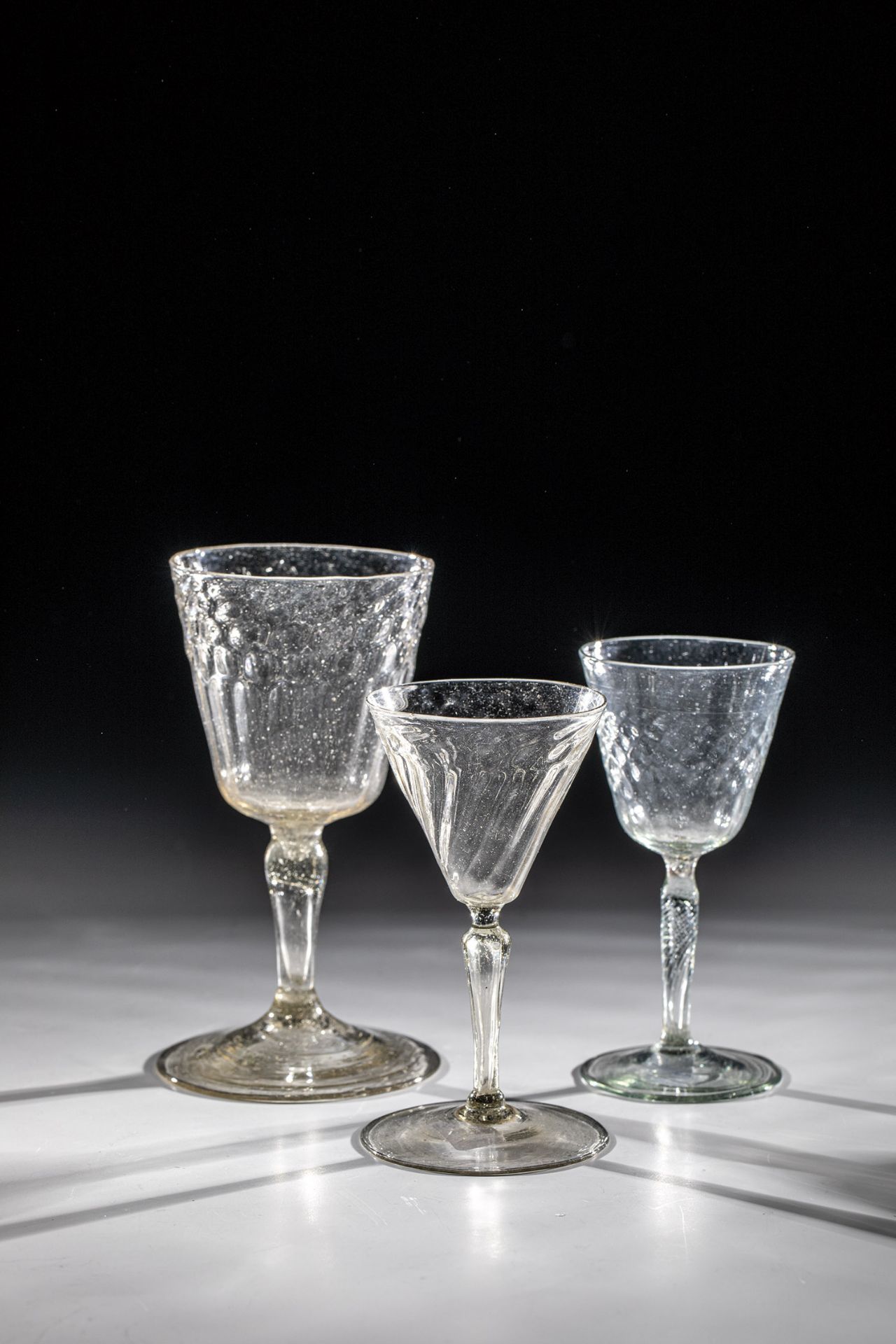 Three goblet glasses France, 17th/18th century Grey or smoke-coloured, thin-walled glass with