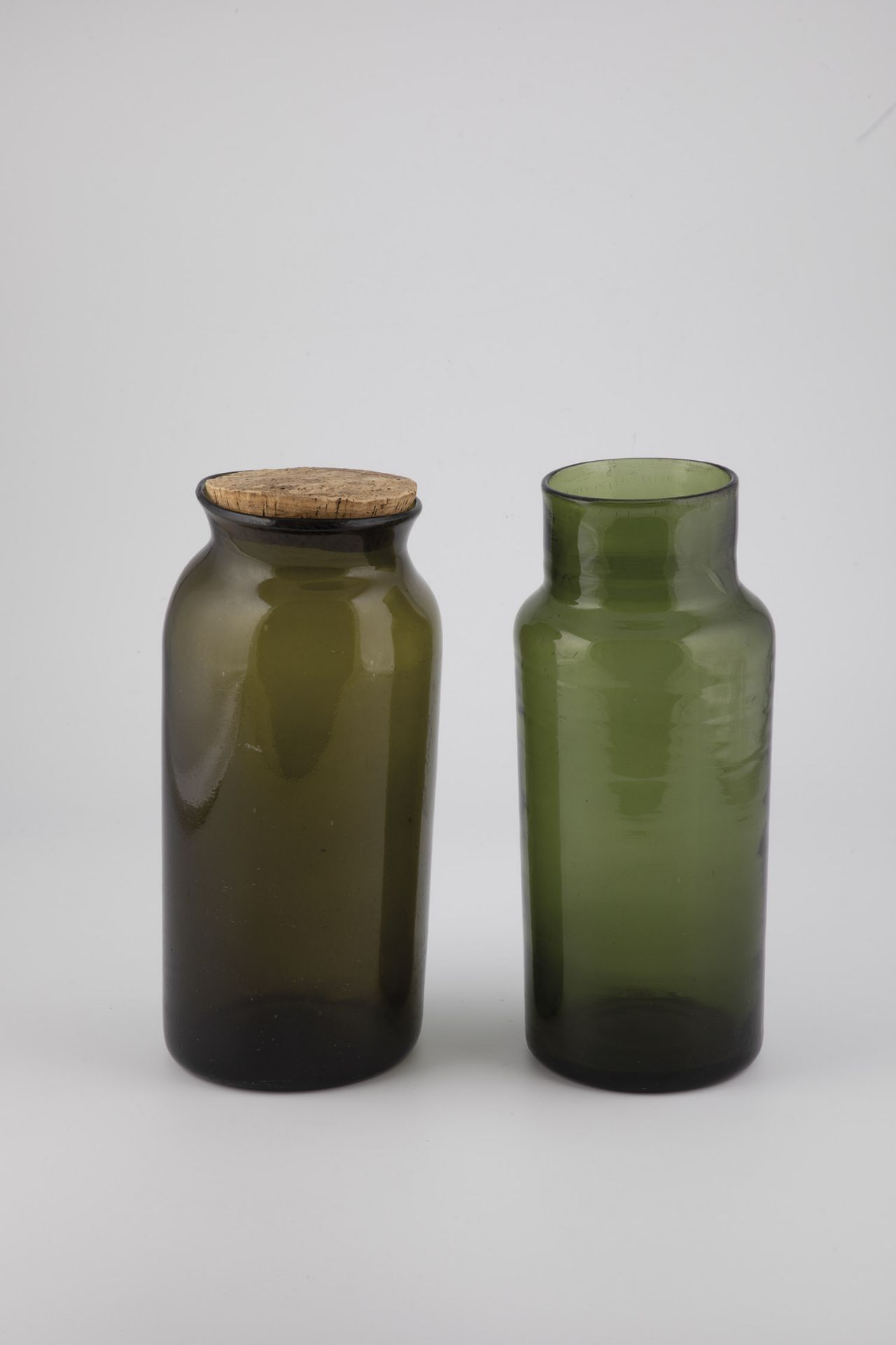 Two storage jars from northern Germany/Belgium, 19th century Green or olive-coloured glass, partly