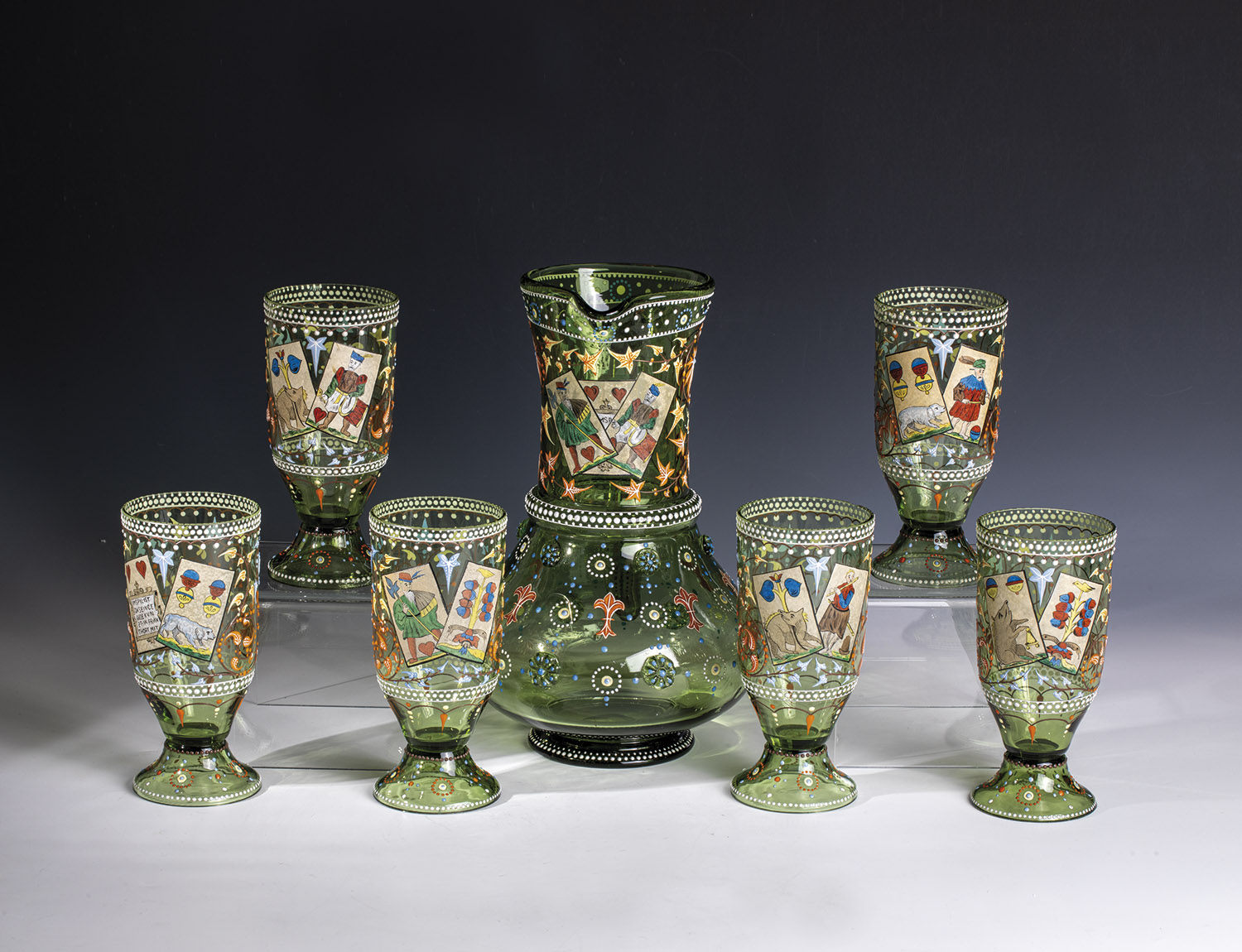 Drinking set with playing card decoration Theresienthal, ca. 1900 Olive green glass with polished