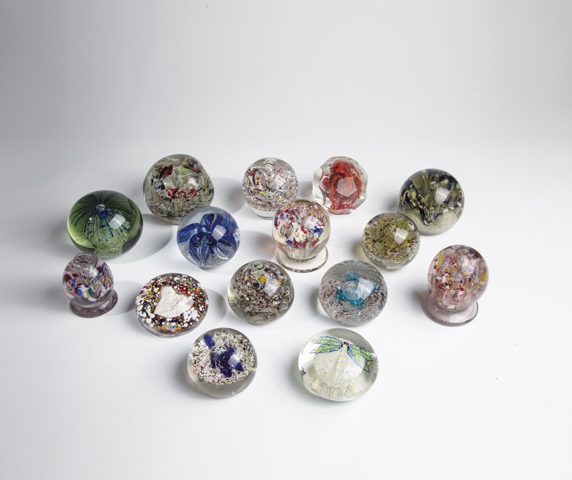 Fifteen paperweights 20th century Bundle of fifteen different, presumably Bohemian, paperweights