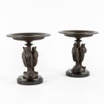 A pair of antique tazza, decorated with African Marabou holding a snake. Patinated spelter. (H:17 x