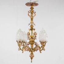 Luppens, a two-tone chandelier, bronze and copper mounted with glass shades. 19th C. (H:90 x D:55 cm