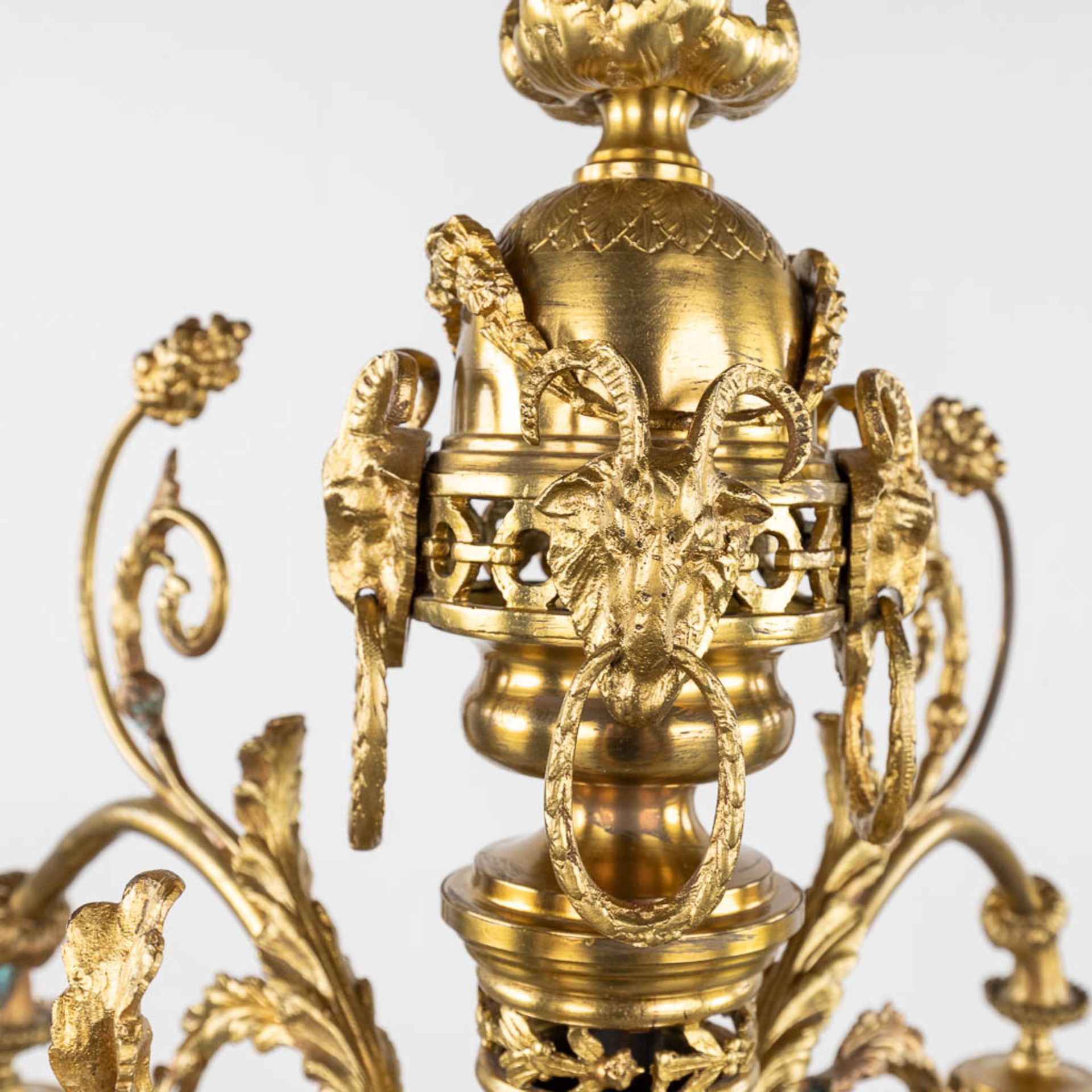 A chandelier, bronze finished with ram's heads, Louis XVI style. (H:93 x D:66 cm) - Image 6 of 13