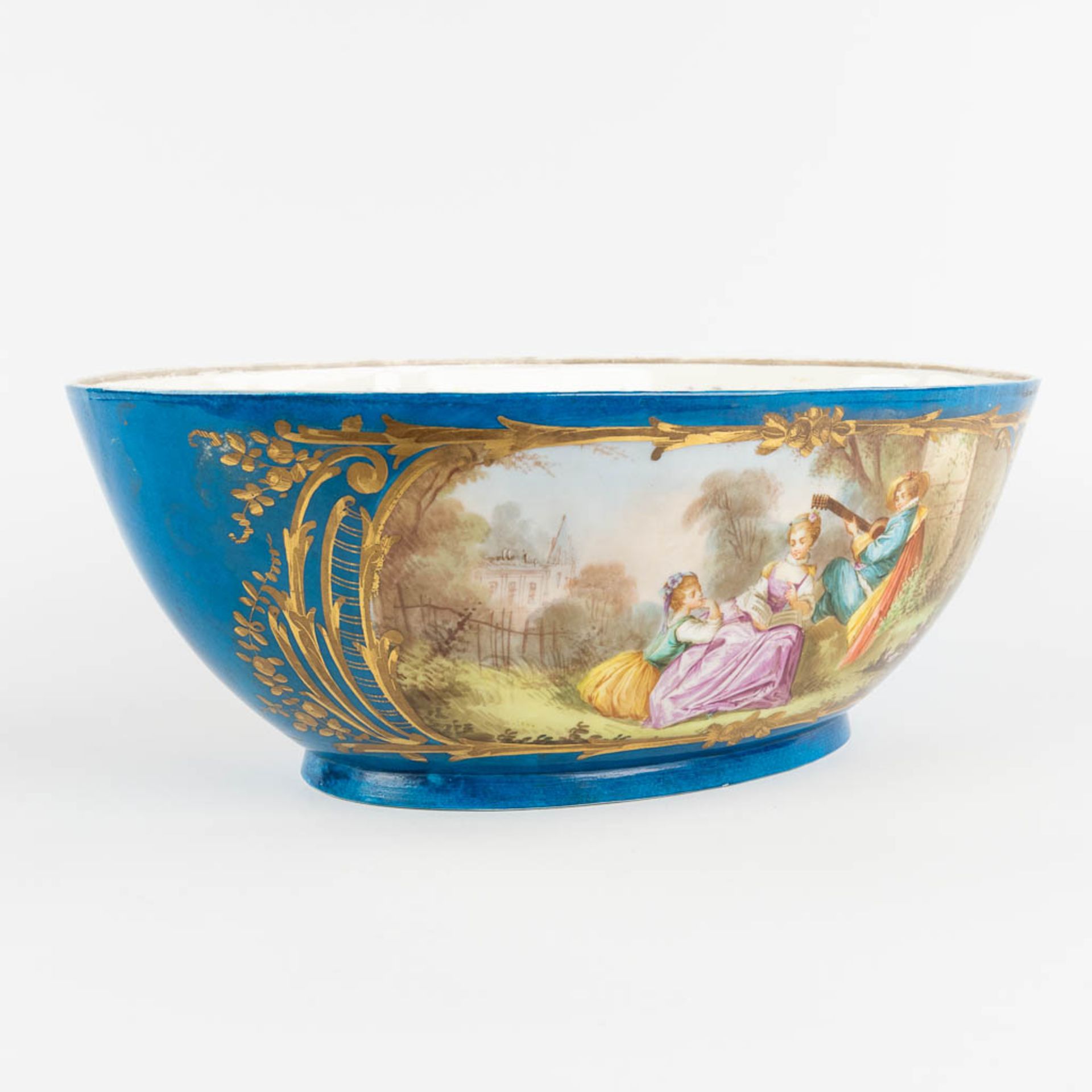 A large bowl, blue glaze with hand-painted decor, probably Limoges. (L:24 x W:39 x H:14 cm) - Image 3 of 12