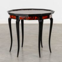 Maison Franck, Antwerp, an octagonal side table, tortoise shell and ebonised wood. (H:65 x D:72 cm)