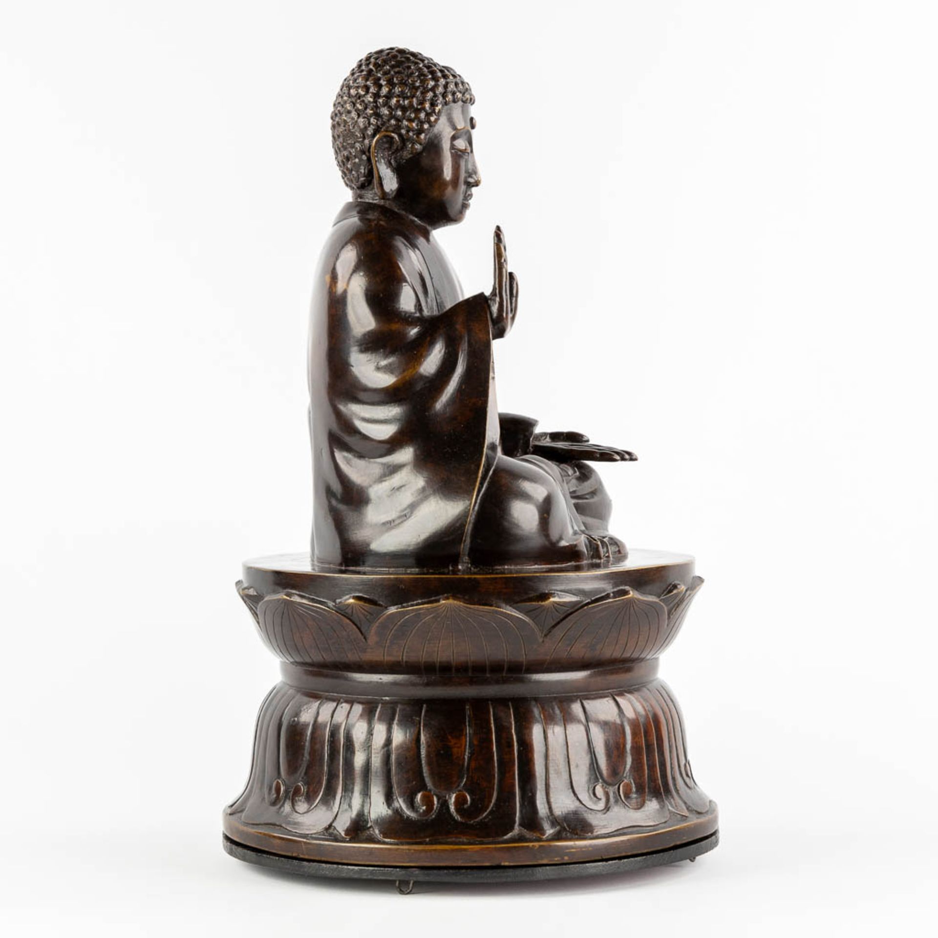 A Buddha seated on a lotus flower, patinated bronze. (H:50 x D:30 cm) - Image 6 of 10