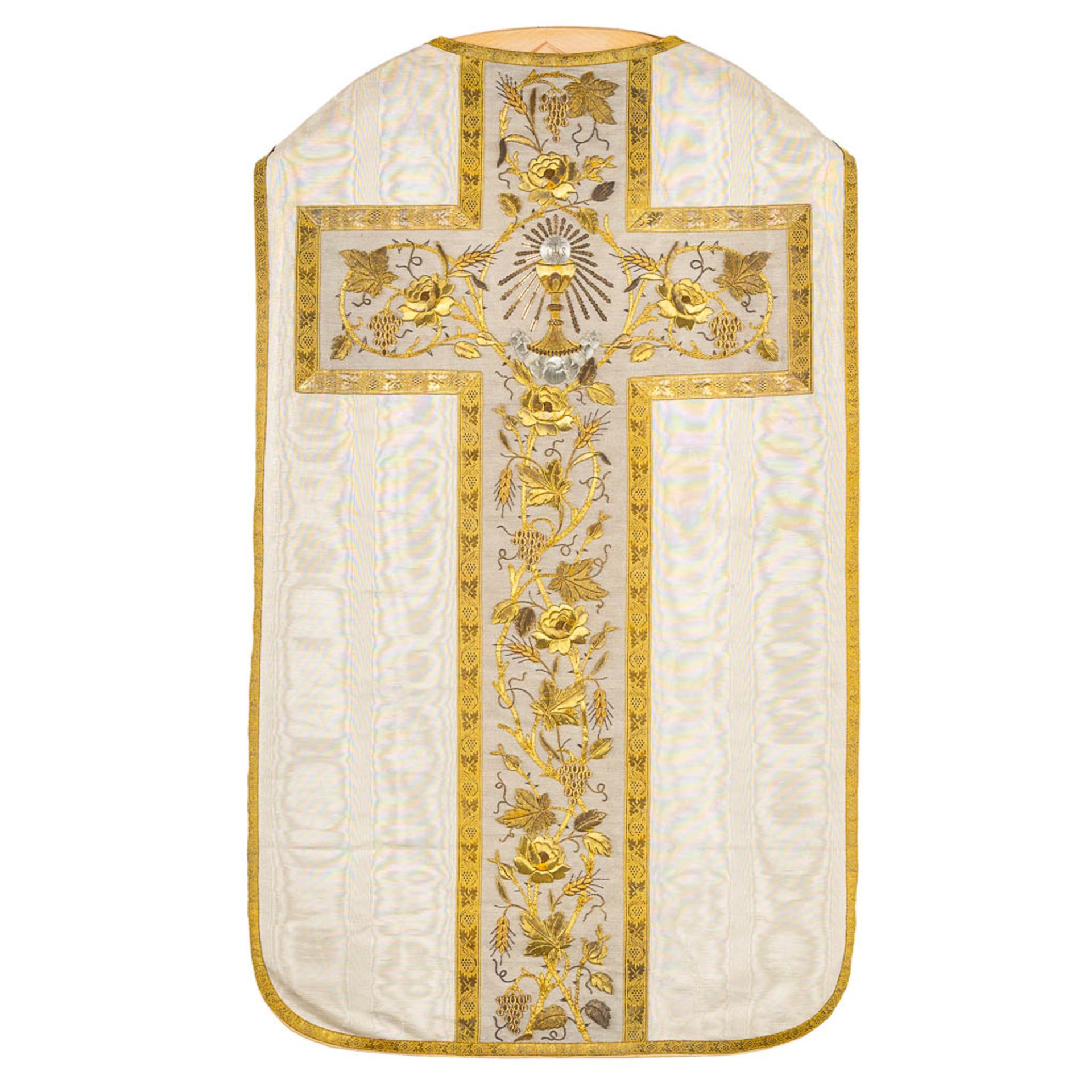 A Roman Chasuble, Thick gold thread brocade with floral decors and the Holy Grail.