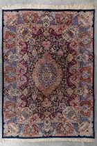 An Oriental hand-made carpet, Kashmar. Signed. (L:350 x W:249 cm)