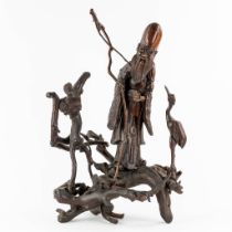 A Chinese Root wood figurine of Shuxing, god of longevity. 19th C. (L:24 x W:45 x H:73 cm)