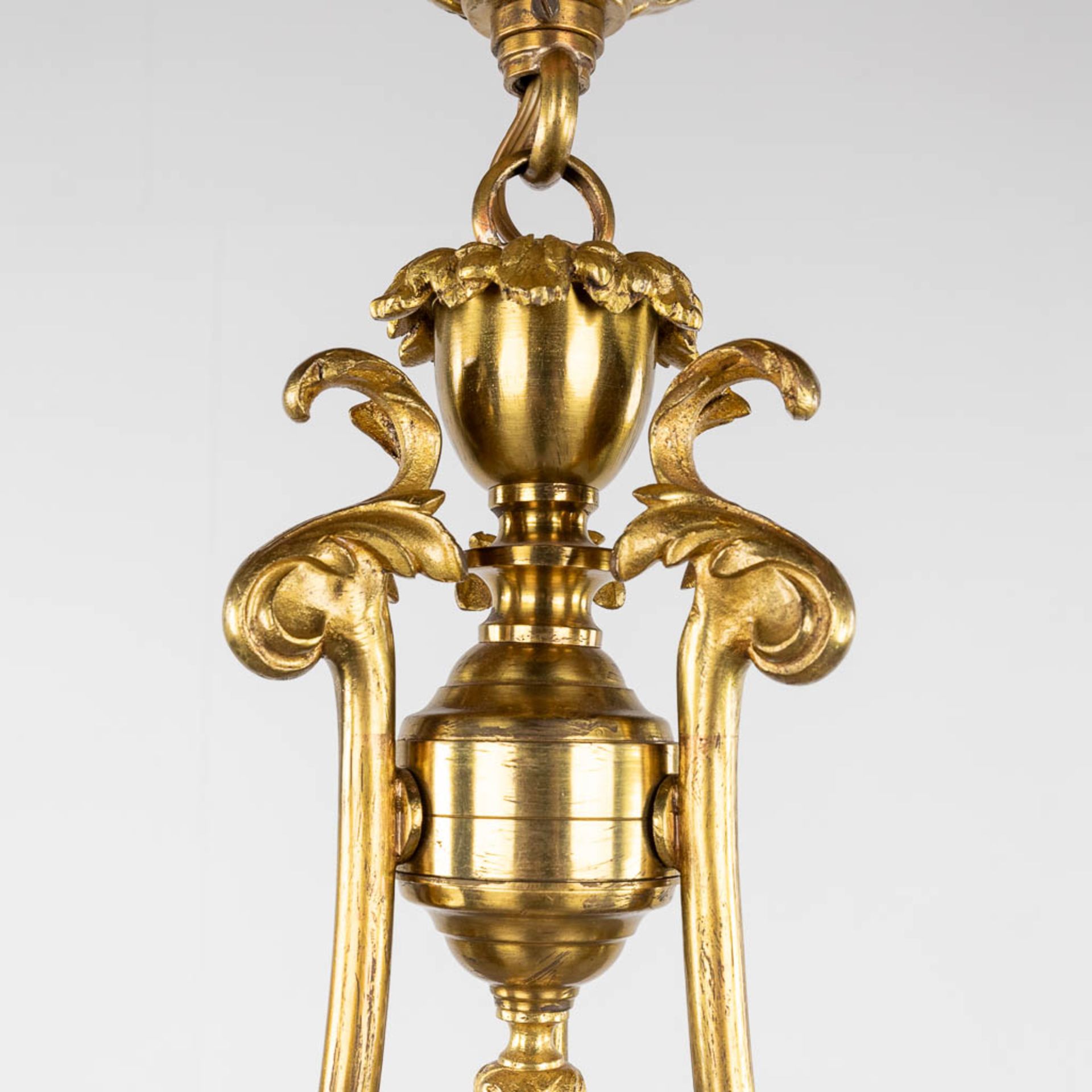 A chandelier, bronze with glass shades and a flambeau, decorated with Satyr figurines. (H:88 x D:54 - Image 5 of 13