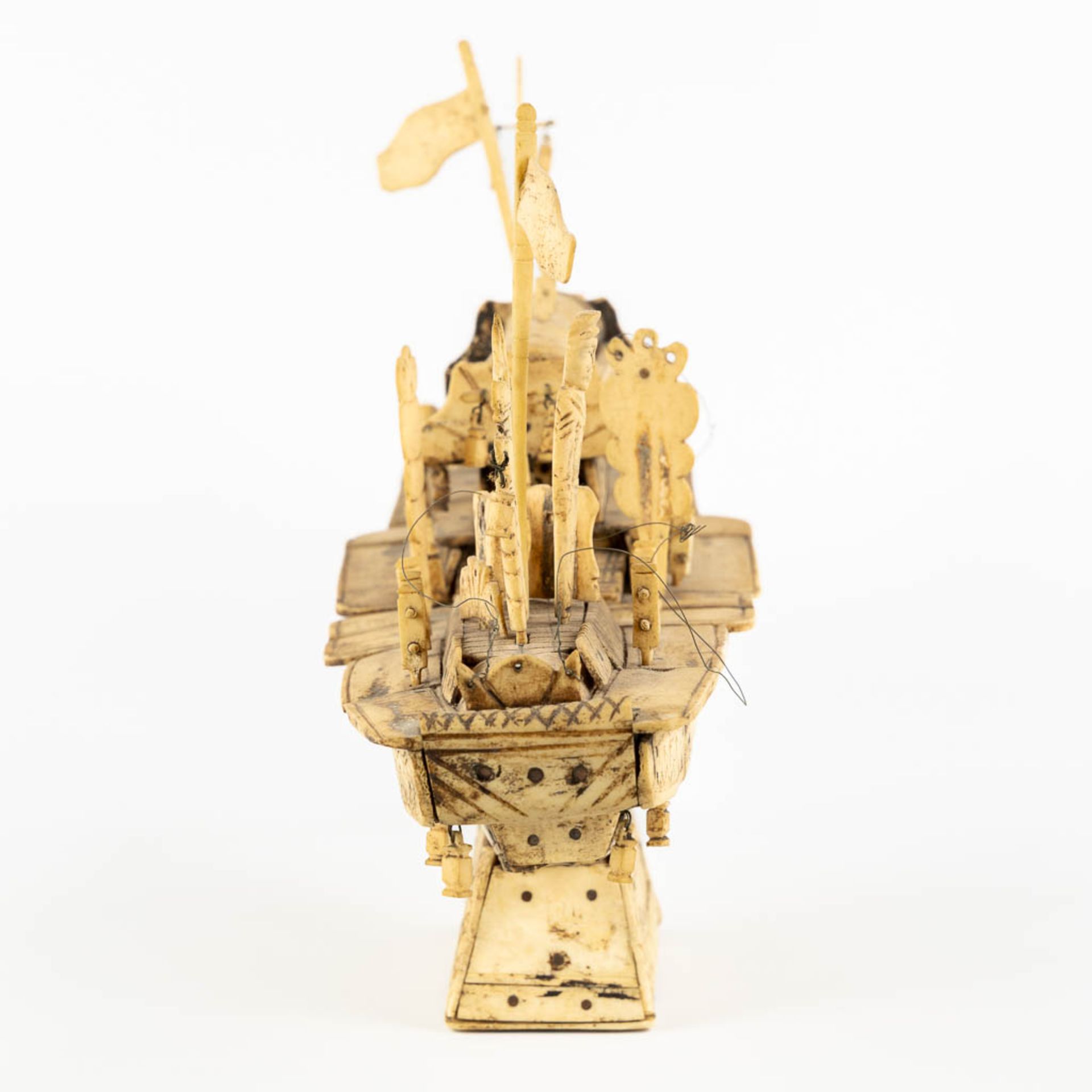 An antique Chinese model of a ship, sculptured bone. Circa 1900. (L:13 x W:50 x H:28 cm) - Image 6 of 11
