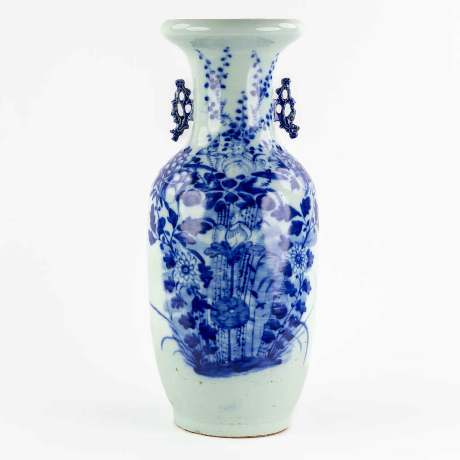 A Chinese Celadon vase with a blue-white fauna and flora decor. 19th/20th C. (H:58 x D:24 cm)