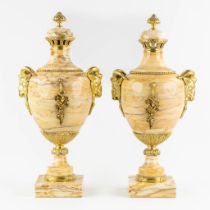 A pair of marble cassolettes, decorated with gilt bronze ram's heads. 19th C. (L:21 x W:25 x H:54 cm