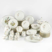 Limoges, France, a large, 12-person dinner, wild and coffee service. (L:23 x W:34 x H:22 cm)