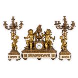 Vauvray, an exceptional gilt bronze and white marble garniture clock and candelabra. France, 19th C.