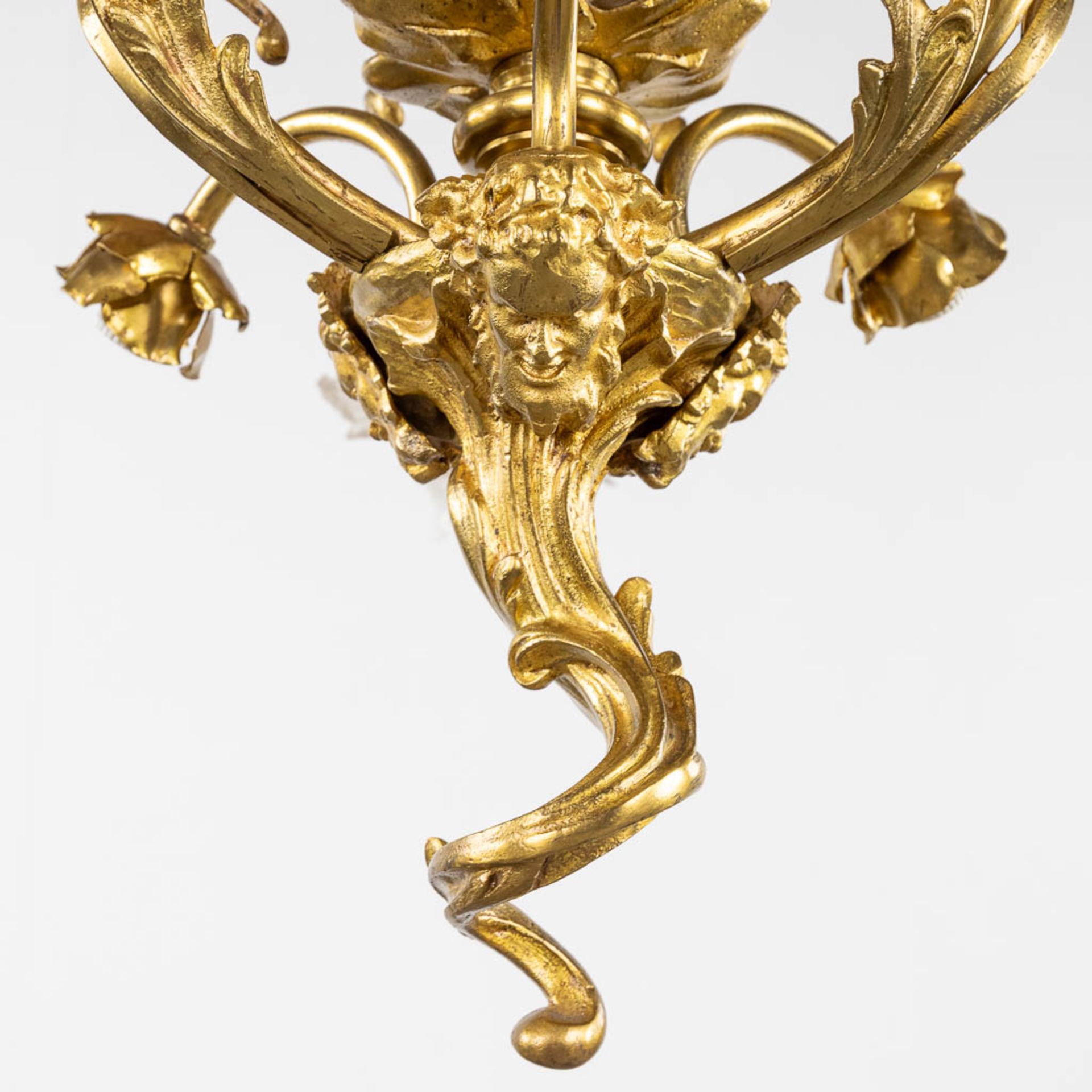 A chandelier, bronze with glass shades and a flambeau, decorated with Satyr figurines. (H:88 x D:54 - Image 9 of 13