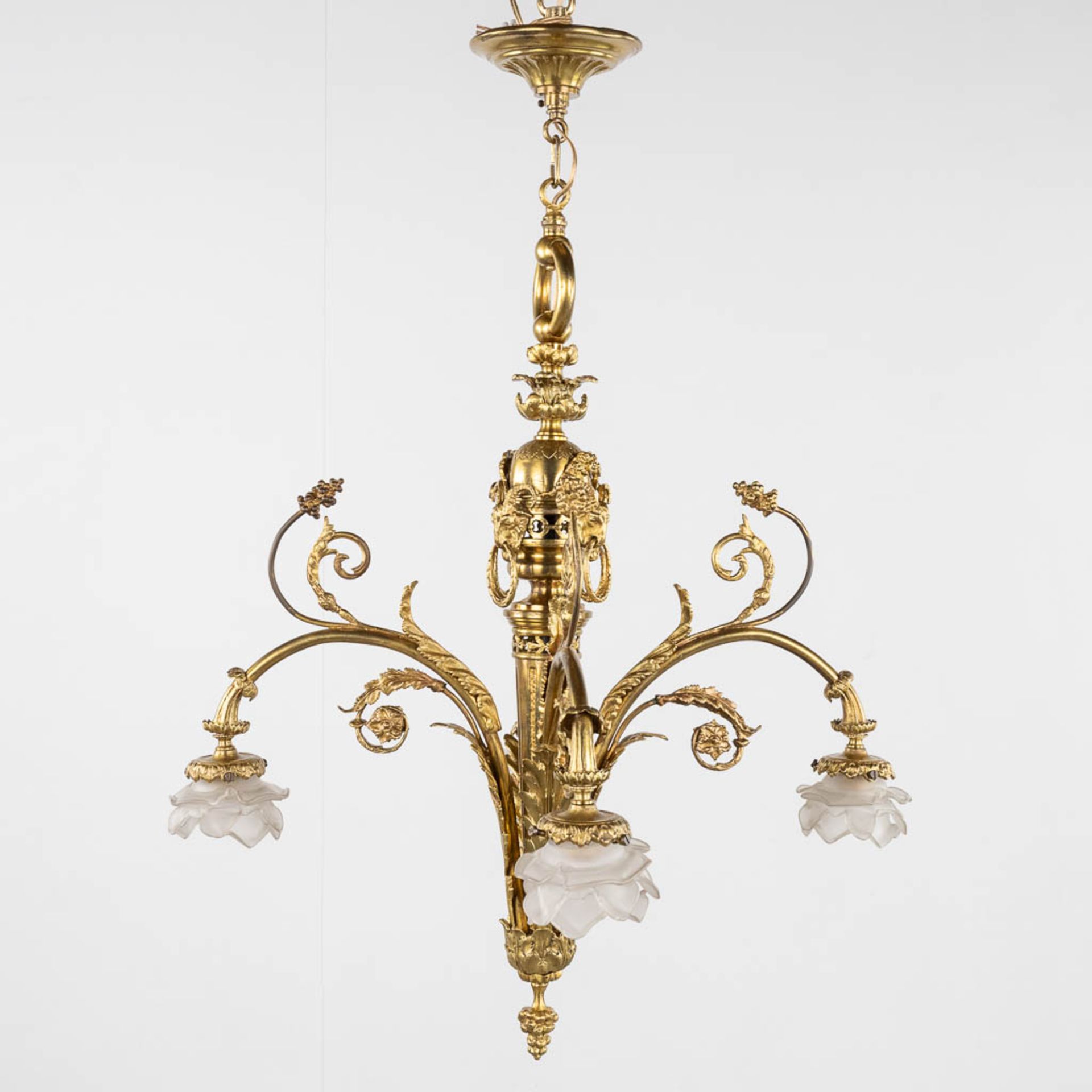 A chandelier, bronze finished with ram's heads, Louis XVI style. (H:93 x D:66 cm) - Image 3 of 13