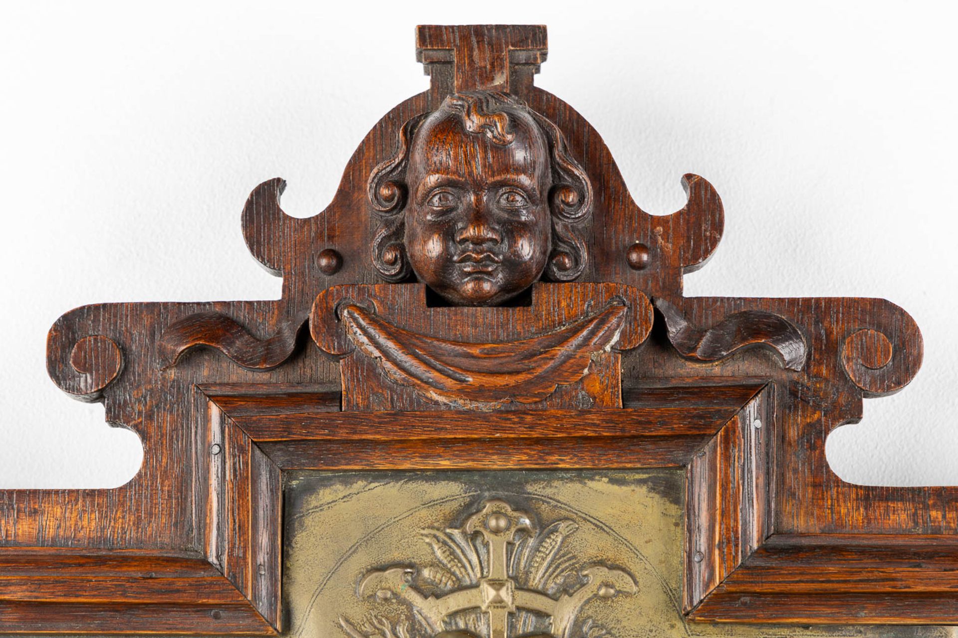 A wall-mounted clock, sculptured oak and repousse copper, decorated with putti and angels. 19th C. ( - Image 3 of 8