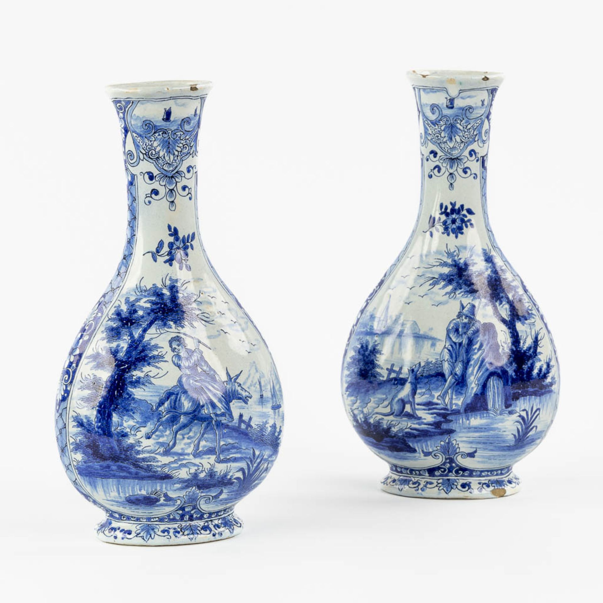 Geertrui Verstelle, Delft, a pair of vases with a landscape decor. Mid 18th C. (L:9 x W:14 x H:26,5 
