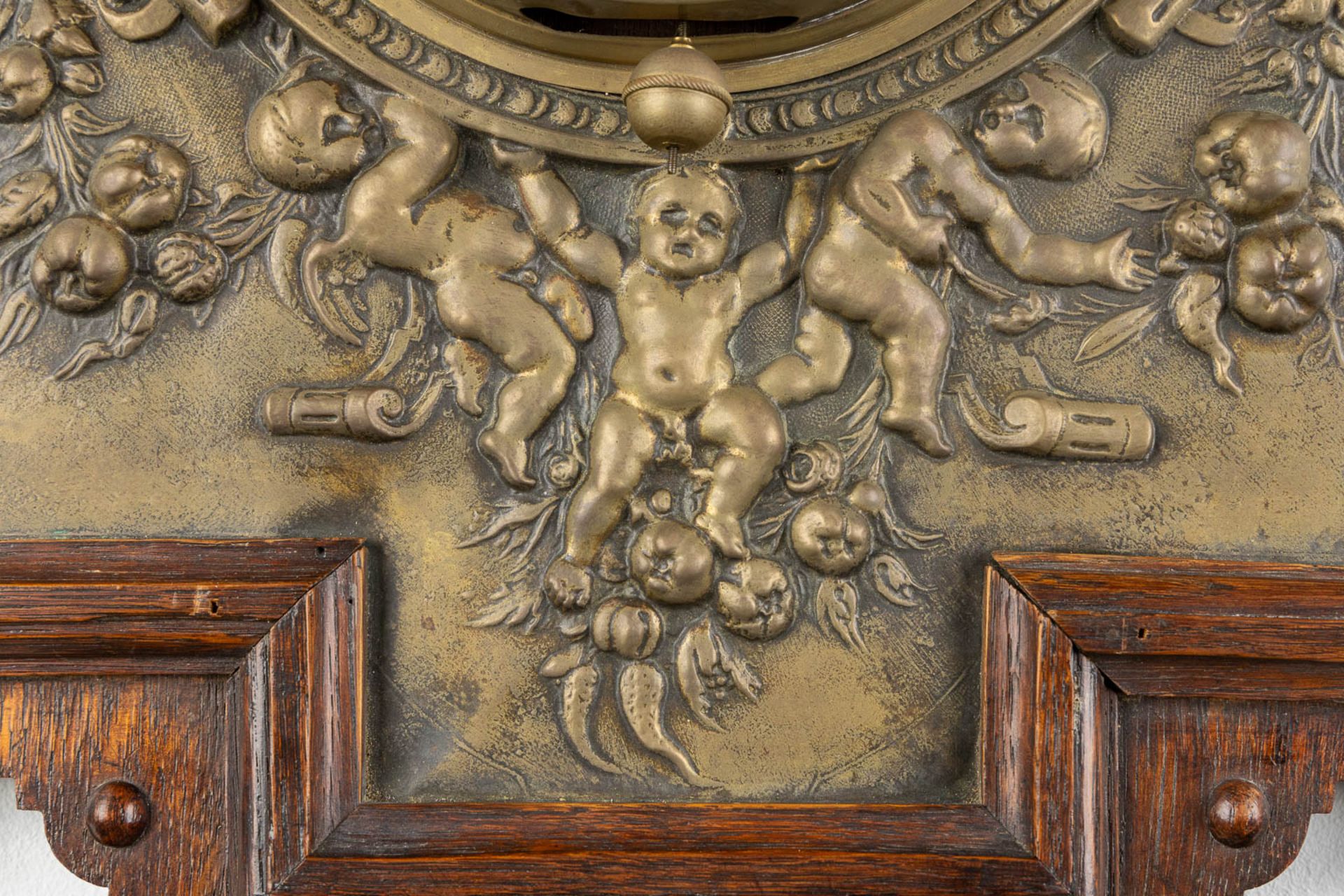 A wall-mounted clock, sculptured oak and repousse copper, decorated with putti and angels. 19th C. ( - Image 7 of 8