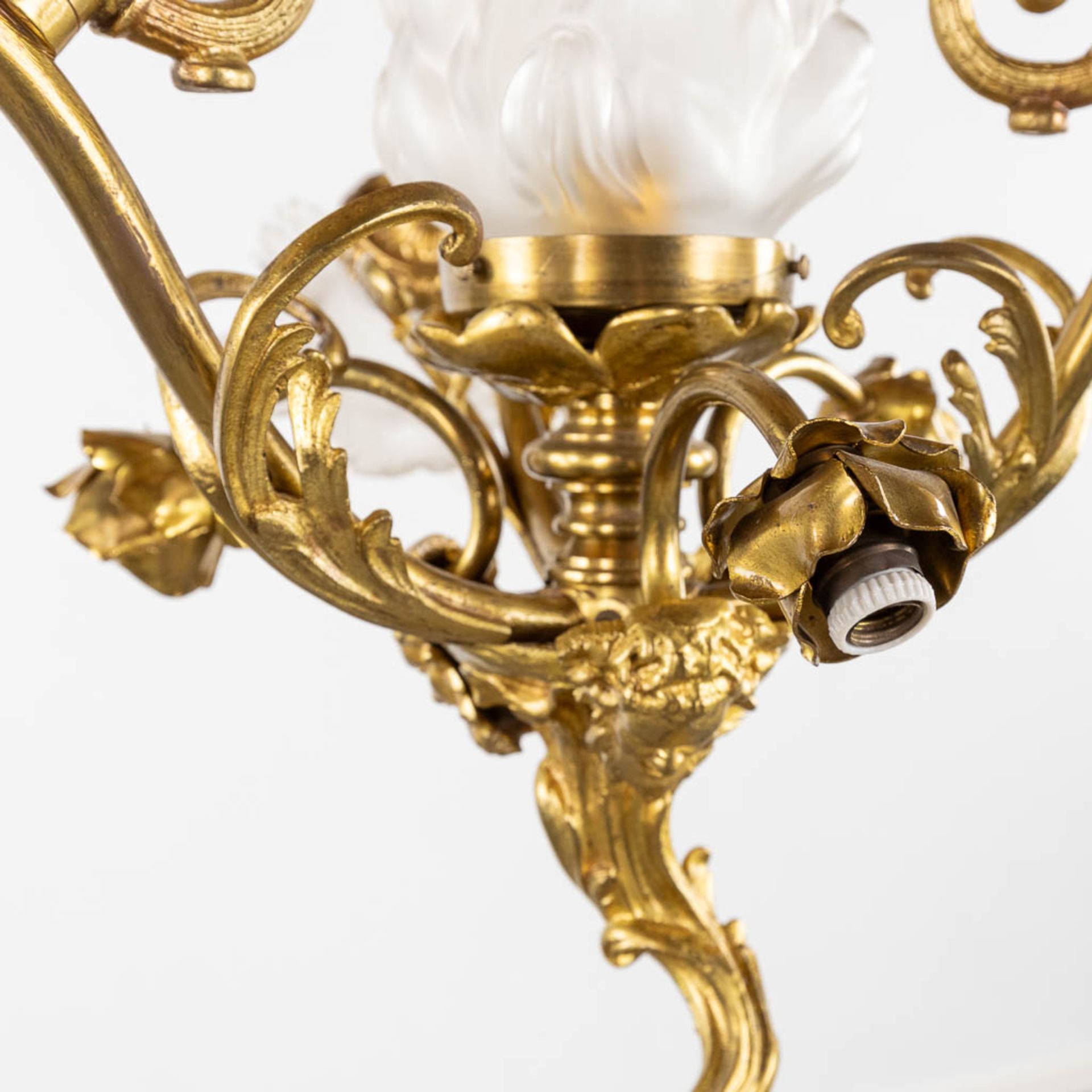 A chandelier, bronze with glass shades and a flambeau, decorated with Satyr figurines. (H:88 x D:54 - Image 8 of 13
