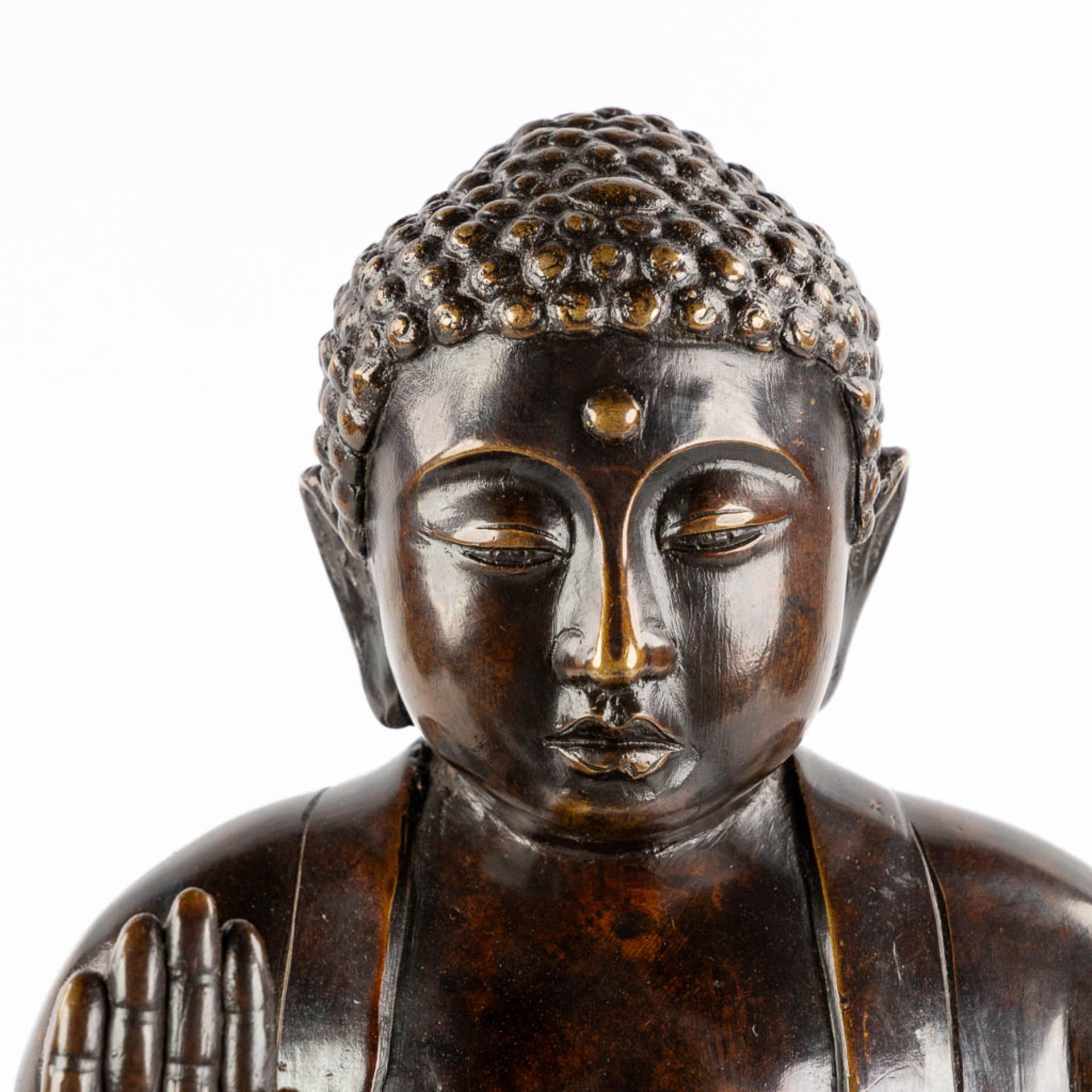 A Buddha seated on a lotus flower, patinated bronze. (H:50 x D:30 cm) - Image 8 of 10